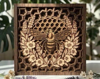 May include: A square wooden wall art piece featuring a multi-layered laser-cut design. The center displays a detailed bee surrounded by a floral wreath, all set against a dark brown honeycomb background. The frame is made of dark natural wood.