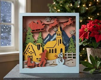 MD525 Christmas Village Shadow Box SVG, plik wycinany laserowo z warstwową sceną kościoła Świętego Mikołaja, dekoracja ścienna dla dzieci z saneczkami, Glowforge CNC
