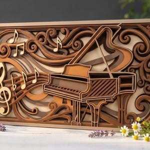 May include: A layered wooden art piece featuring a grand piano and musical notes. The artwork uses various shades of brown and tan to create depth and dimension. Decorative swirls and a treble clef add to the musical theme.