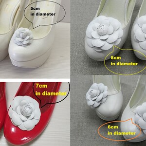 May include: Four pairs of shoes with white fabric flower embellishments. The flowers are different sizes, measuring 5 cm, 6 cm, 7 cm, and 8 cm in diameter.