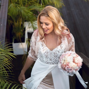 Beautiful bride wearing a lace bridal bolero.
Lace shawl, bridal shrug, wedding bolero, wedding party, bridesmaids shawl