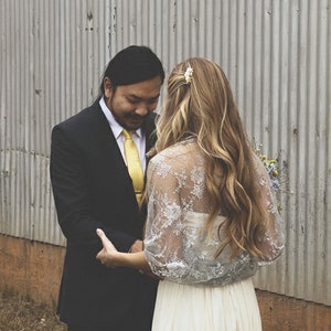 Beautiful bride wearing a silver lace bridal bolero.
Silver lace shawl, bridal shrug, wedding bolero, wedding party