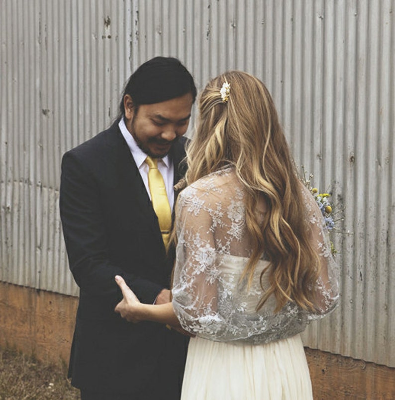 Beautiful bride wearing a silver lace bridal bolero.
Silver lace shawl, bridal shrug, wedding bolero, wedding party