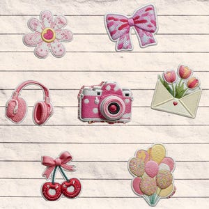 May include: Embroidered patches featuring a pink flower, bow, headphones, camera, envelope with tulips, cherries, and balloons. Each patch has a white outline and is set against a wood-grain background. The patches are in shades of pink and red.