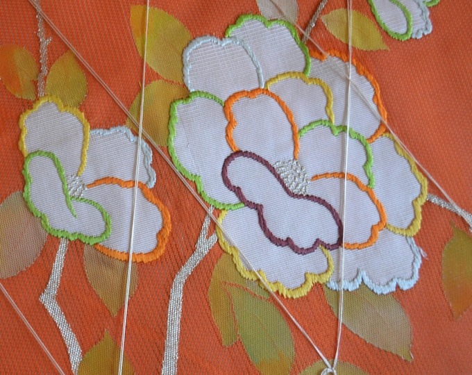 Vintage Japanese unused summer nagoya obi textured woven floral camellia embroidered pattern, orange. Light weight unopened.