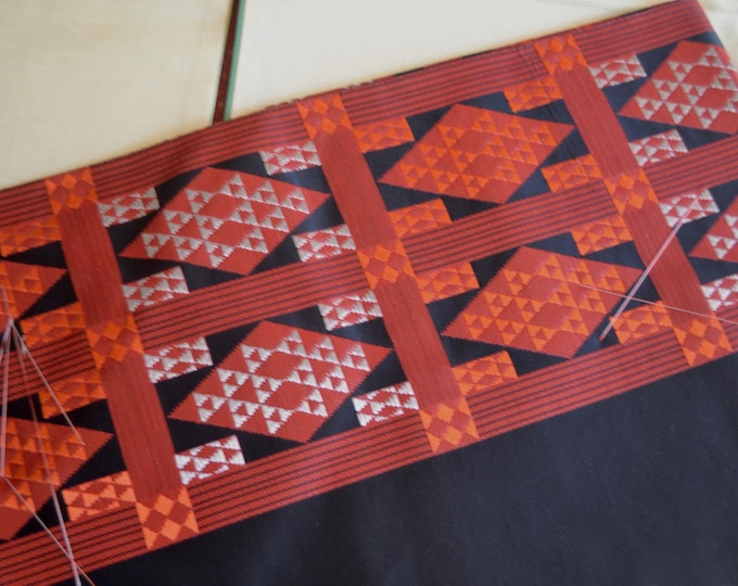 Vintage Japanese unused nagoya obi  black silk with a woven geometric pattern with silver and metallic red thread .  Black reverse.