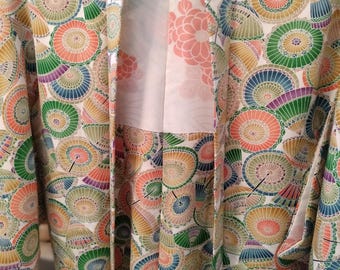 Vintage Japanese hand stitched silk  haori kimono jacket. Colourful pattern of bangasa paper umbrellas in green blue and orange. Fun playful
