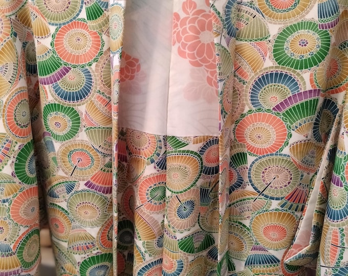 Vintage Japanese hand stitched silk  haori kimono jacket. Colourful pattern of bangasa paper umbrellas in green blue and orange. Fun playful