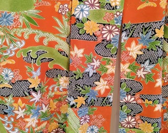 Vintage 1980's Japanese  handsewn chirimen crepe silk kimono with traditional flowers and floral pattern. Shades of vibrant orange & green