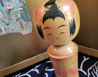 Vintage traditional collectible Japanese kokeshi wooden doll. Flower design. Handmade and hand crafted. 25cm tall 450 grams. Signed on base.