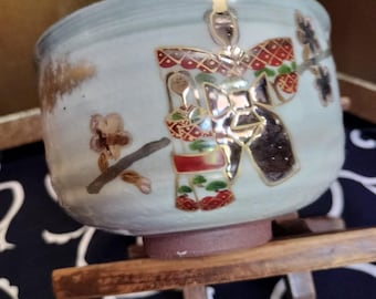 Vintage Japanese hand-made tea bowl. Kyo-ware, brown stoneware, with cream glaze. Sakura momo no hana Hina Matsuri pattern signed by artist.