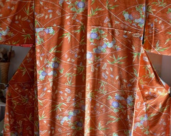Vintage 1980's Japanese  handsewn kimono with  dyed pattern of Japanese flowers. Komon kimono.  Orange colour w/ amethyst lime carnelian red