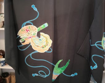 Vintage Japanese hand stitched silk haori kimono jacket. Black w/ yuzen dyed traditional pattern in bright green colourful floral lining.