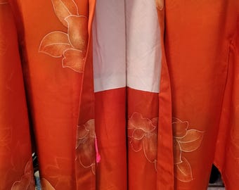 Vintage Japanese hand stitched silk  haori kimono jacket. Orange floral flower arabesque yuzen dyed w/ colourful himo ties. Geometric lining