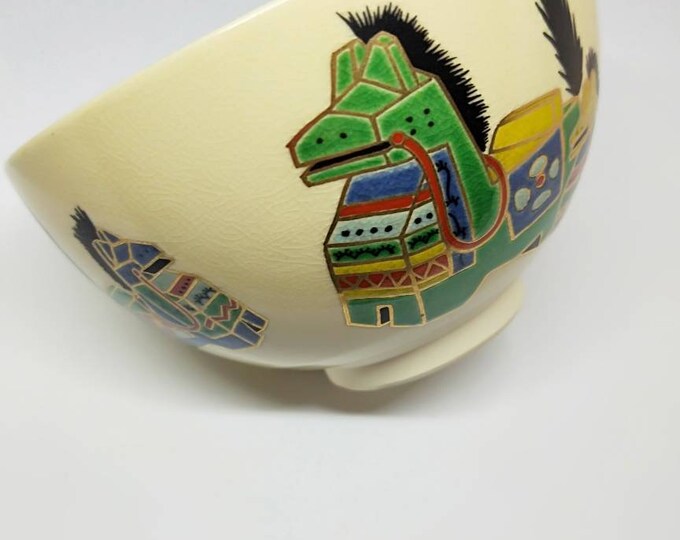 Vintage Japanese hand-made tea bowl. Kyo-ware, white stoneware, with cream glaze and on-glaze paint toy horse or miharu-goma.