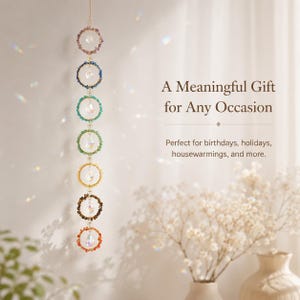 May include: A vertical hanging ornament featuring seven circular rings, each adorned with small colorful beads and a central clear crystal prism. The text reads: A Meaningful Gift for Any Occasion. Perfect for birthdays, holidays, housewarmings, and more.