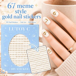 May include: A light blue rectangular sheet of gold number nail stickers featuring the text LUTOY C STICK YOUR WORLD and DH-577. The sheet contains rows of digits from zero to nine. A smaller white sheet of gold number stickers is also shown.