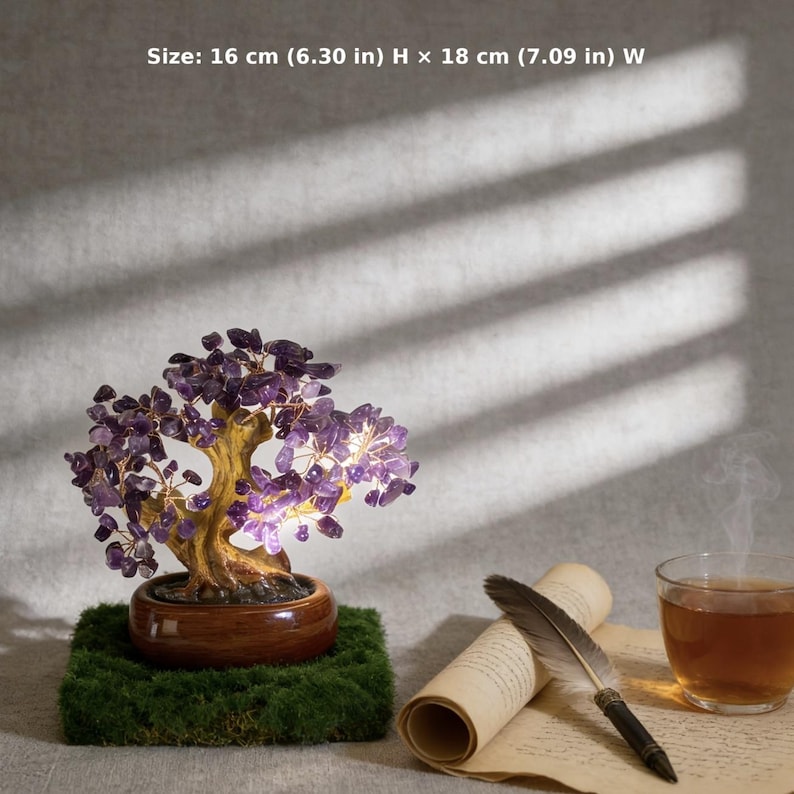 May include: A decorative bonsai tree with purple amethyst leaves, set in a brown pot on a mossy base. The tree is 6.30 inches high and 7.09 inches wide. A scroll, feather pen, and a cup of tea are next to the tree.