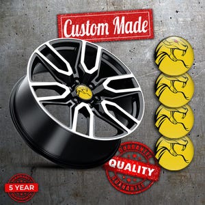 May include: A custom-made black and white car wheel with a yellow emblem. The wheel has a five-year warranty and a quality guarantee. Four yellow emblems with a snake design are also included.