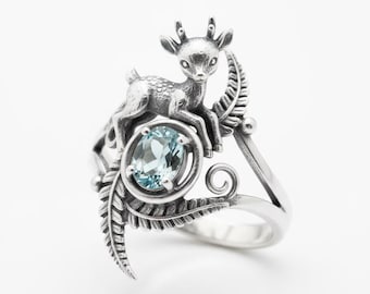 Anillo de ciervo con gema, anillo llamativo de plata con diseño de animal y piedra azul claro.