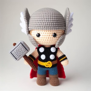 May include: A set of three ceramic mugs with a speckled, matte finish. The mugs are in shades of cream, light brown, and dark brown. Each mug has a simple, minimalist design and a rounded handle.