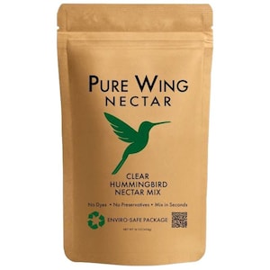 May include: A brown paper bag of Pure Wing Nectar, a clear hummingbird nectar mix. The bag features a green hummingbird graphic and text that reads "Pure Wing Nectar" and "Clear Hummingbird Nectar Mix." The bag is labeled "Enviro-Safe Package" and contains 16 oz (454g).