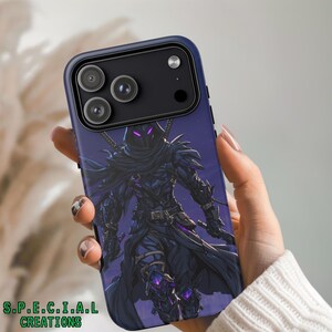 May include: A dark blue phone case featuring a detailed illustration of a cloaked warrior with purple accents. The case has a black camera module and the text "S.P.E.C.I.A.L CREATIONS" at the bottom.