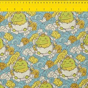 May include: A repeating pattern of cartoon characters in eggs with crowns, set against a blue and white wavy background with yellow clouds and treasure chests. The characters are green with smiling faces.
