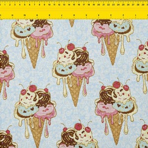 May include: Light blue fabric with a repeating pattern of ice cream cones. Each cone features scoops of vanilla, chocolate, and strawberry ice cream, topped with a cherry. The cones are dripping with melted ice cream.