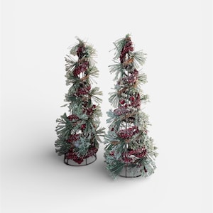 Peut inclure: Deux arbres de No&euml;l d&eacute;coratifs. Chaque arbre est une armature m&eacute;tallique recouverte de fausses aiguilles de pin vertes, de baies rouges et d'une fine couche de neige blanche. Les arbres sont sur fond blanc.