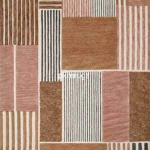 May include: A rectangular rug with a geometric pattern. The rug features blocks of color in shades of brown, pink, and cream, with vertical stripes and solid squares. The design is modern and abstract, suitable for a living room or bedroom.