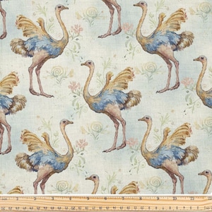 Peut inclure: Tissu avec un motif répété d'autruches aux tons de beige, bleu et rose. Les autruches sont représentées avec leurs ailes déployées, sur un fond bleu clair avec des motifs floraux. La règle en bas mesure en centimètres.