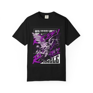 May include: Black t-shirt featuring a purple graphic of an angel statue with the words "REBEL ANGEL" in a stylized font. The shirt also includes the text "ESTO 188P" and a barcode.