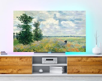 May include: A large flat-screen TV displays a colorful impressionist landscape painting. The artwork features a field of flowers, trees, and a cloudy sky. The TV is set on a white and wood-toned entertainment center.