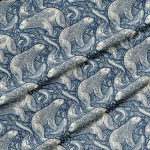 May include: A fabric pattern with a repeating design of polar bears and seals in blue and off-white. The bears and seals are intricately detailed with swirling patterns, set against a backdrop of stylized foliage.