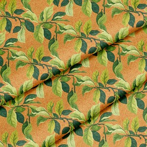 May include: A fabric featuring a repeating pattern of green leaves and branches set against an orange backdrop. The leaves display varying shades of green, while the branches are dark brown. The orange background has a subtle, textured appearance.