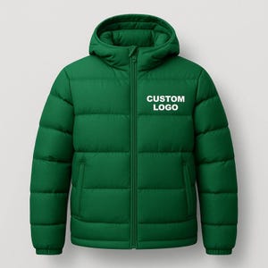 May include: A green puffer jacket with a hood and a zipper closure. The jacket has the words "CUSTOM LOGO" printed in white on the chest. The jacket is designed for warmth and protection from the elements.