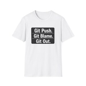 May include: White t-shirt with a black rectangular graphic. The graphic features the text "Git Push. Git Blame. Git Out." in a bold, sans-serif font. The shirt has a crew neck and short sleeves.