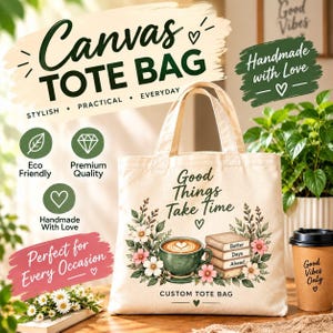 May include: A beige canvas tote bag featuring a printed graphic of a green coffee cup, a stack of books labelled Better Days Ahead, and floral accents. The text Good Things Take Time is printed above the illustration, with Custom Tote Bag below.