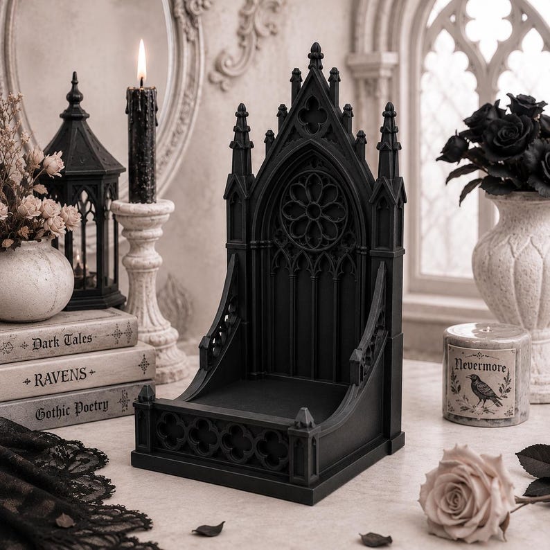 Black Gothic Cathedral phone stand displayed on a modern desk holding a smartphone.
Side view of Gothic Cathedral phone holder showing detailed medieval window design.
Front view of cathedral-inspired smartphone stand with gothic architectural details.