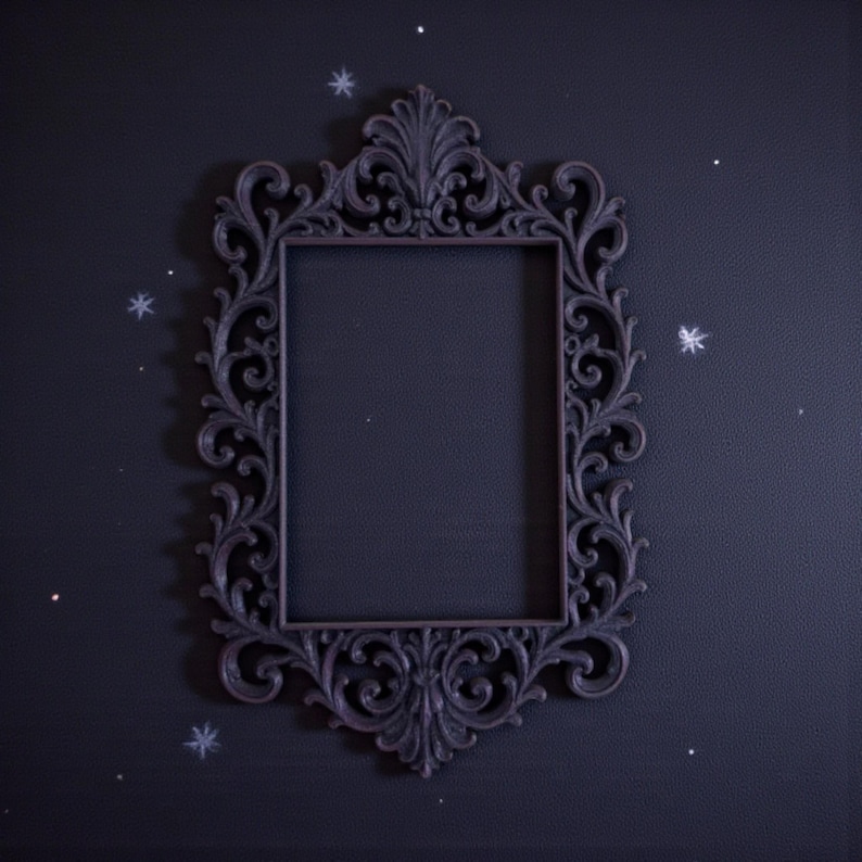 Ornate gothic baroque photo frame with intricate scrollwork and rectangular shape, styled as dramatic dark wall decor.