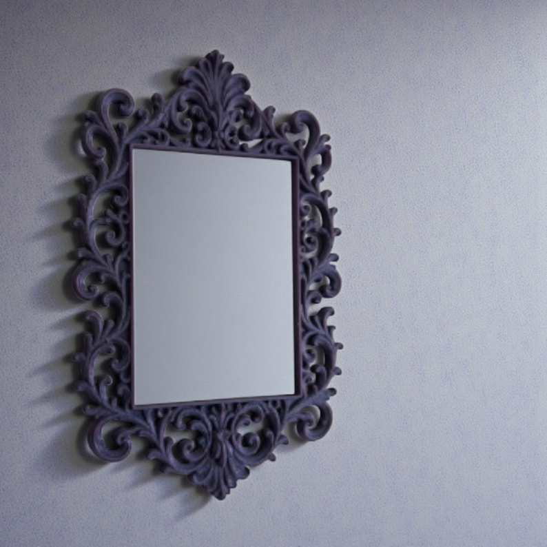 Ornate gothic baroque photo frame with intricate scrollwork and rectangular shape, styled as dramatic dark wall decor.