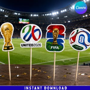 May include: Four decorative food toppers on wooden picks featuring FIFA World Cup 2026 themes. The designs include a gold trophy, a circular United 2026 logo, a stylized 26 with a trophy, and a soccer ball graphic with the text Trionda.