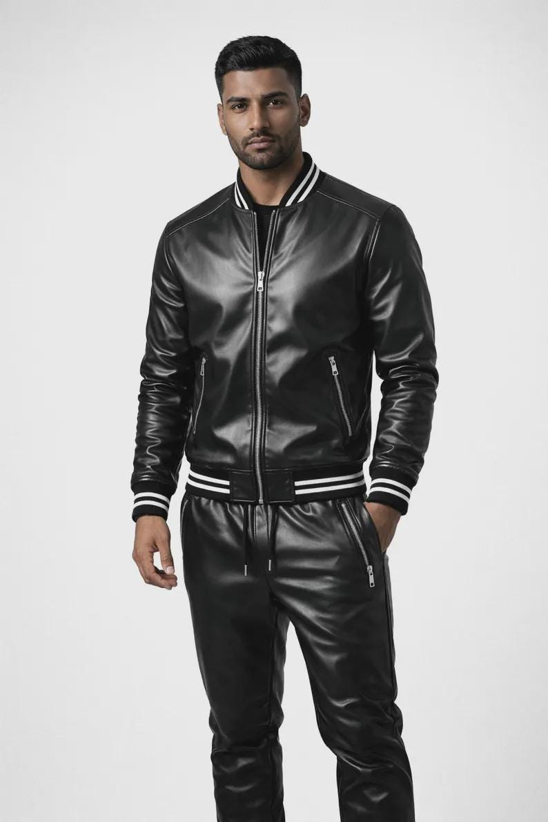 May include: Black leather bomber jacket with white stripes on the collar, cuffs, and waist. The jacket has a zipper closure and two side pockets. Matching black leather pants with a drawstring waist and zippered pockets complete the outfit.
