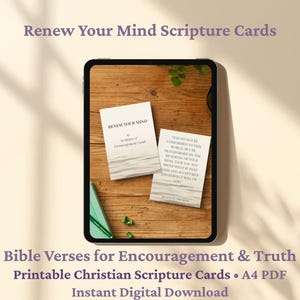 May include: A digital tablet displays two scripture cards on a wooden surface. The cards, titled "Renew Your Mind," feature Bible verses for encouragement. The image includes text: "Bible Verses for Encouragement & Truth" and "Instant Digital Download."