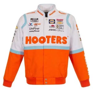 May include: White, orange, and light blue racing jacket with the word "HOOTERS" in large orange letters across the chest. The jacket has multiple sponsor logos and the words "NASCAR CUP SERIES".