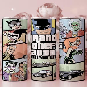 May include: A cylindrical tumbler featuring a comic book style graphic wrap with the text Grand Theft Auto Gotham City. The design displays various characters including Batman, Joker, Harley Quinn, and Mr. Freeze, alongside vehicles like a police car.