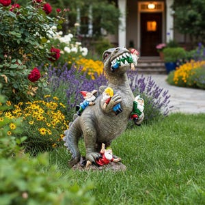 May include: A grey dinosaur garden ornament with a menacing expression, its mouth filled with colourful garden gnomes. Several gnomes are also clinging to the dinosaur's back and sides, creating a whimsical outdoor decoration.