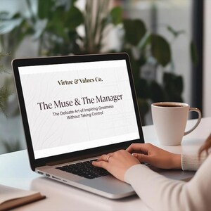 May include: A laptop displaying the text "Virtue & Values Co." and "The Muse & The Manager". A white mug with coffee sits to the right. The laptop is on a white desk with a book and a small white object.
