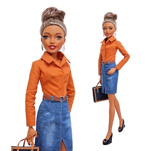 May include: A fashion doll with brown skin and brown hair styled in a high bun, wearing an orange long-sleeve button-down shirt, a blue denim skirt with a front slit, a brown belt, and black wedge shoes, while carrying a dark blue handbag.